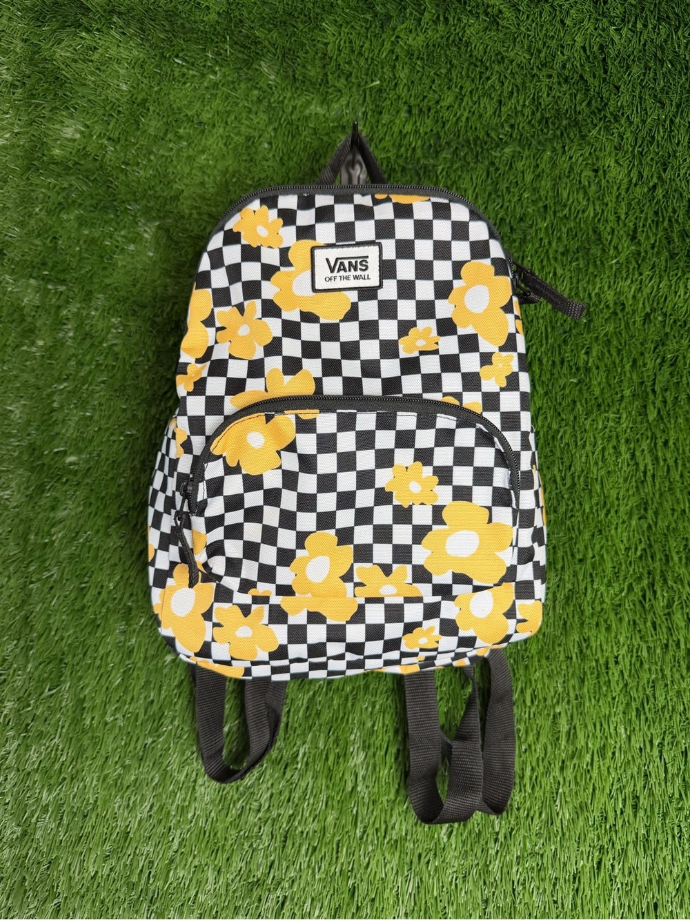 Vans Black-and-White Checkerboard Backpack with Yellow Floral Print